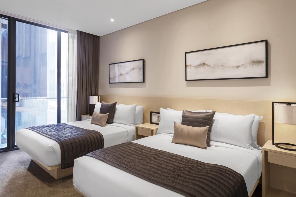 Skye Hotel Suites Parramatta Exterior photo A typical bedroom at the hotel