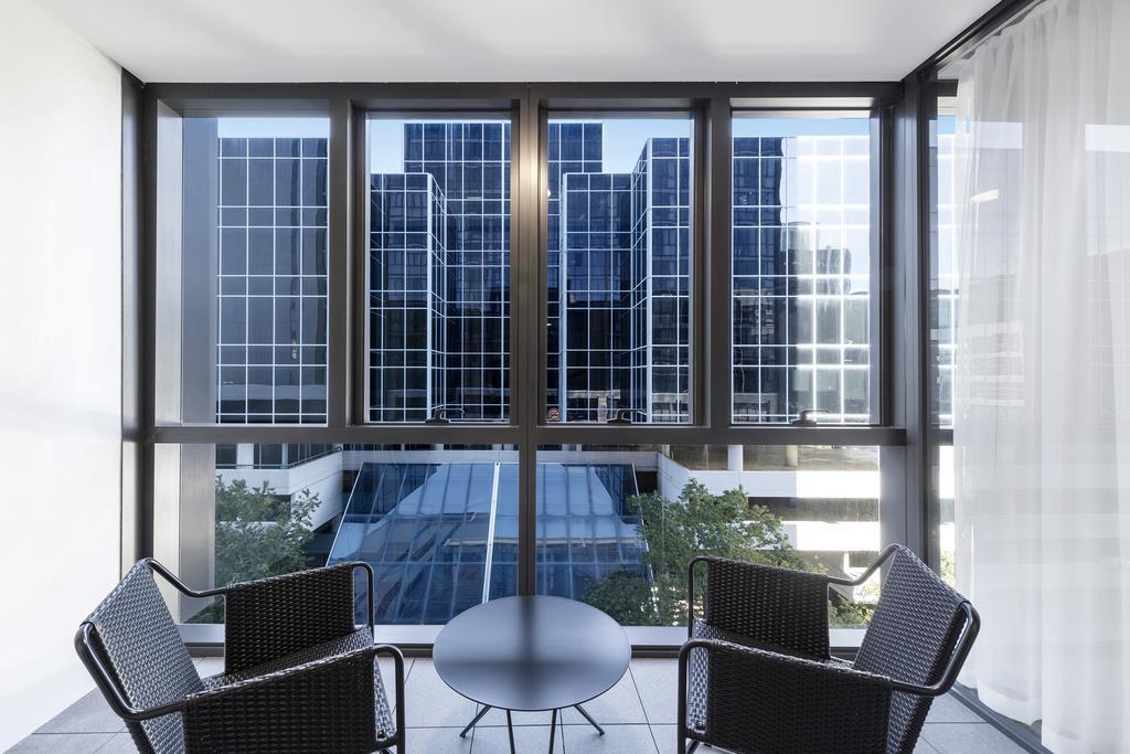 Skye Hotel Suites Parramatta Exterior photo A typical apartment balcony